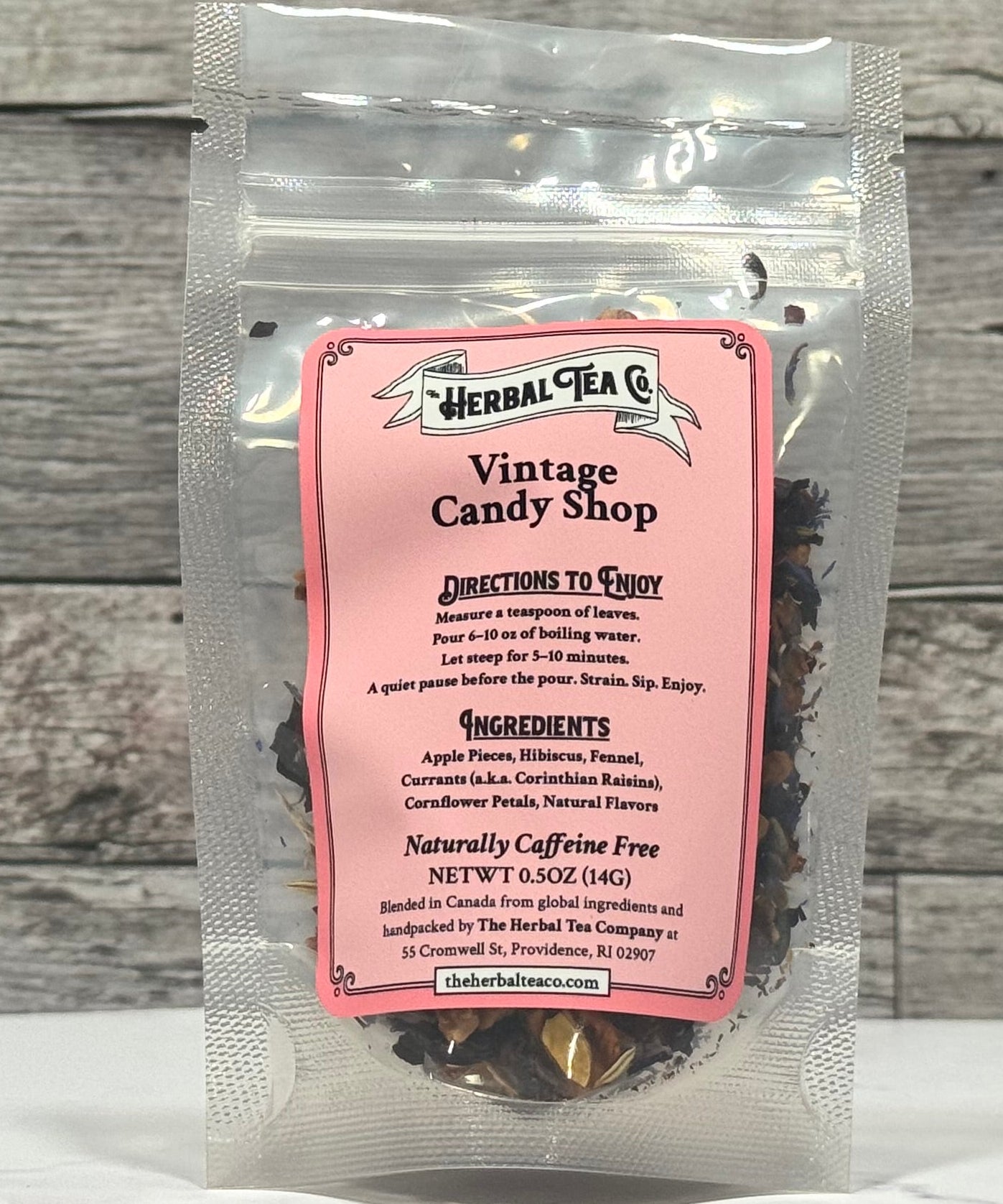Herbal Tea Co. vintage candy shop tea package on a wooden surface