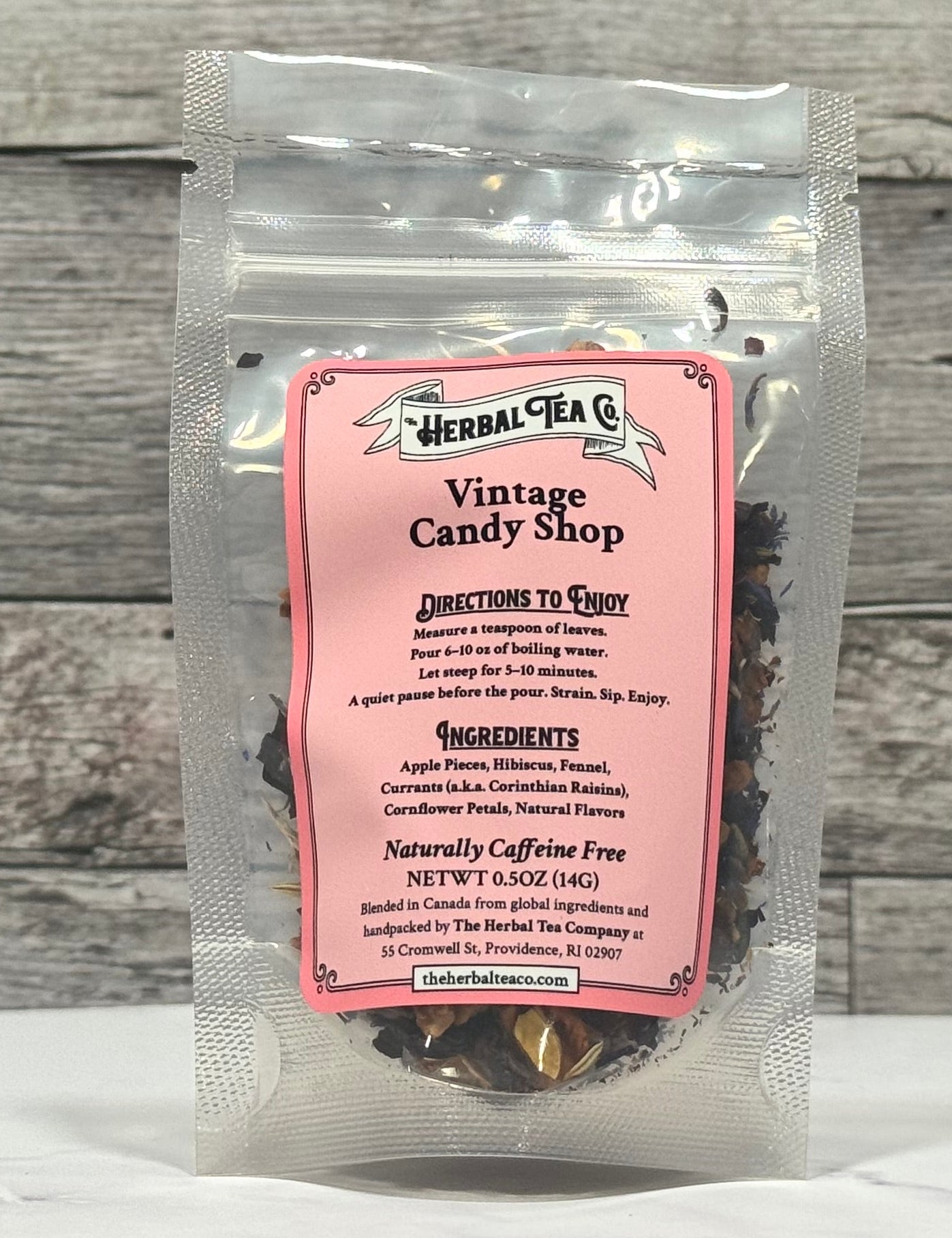 Herbal Tea Co. vintage candy shop tea package on a wooden surface