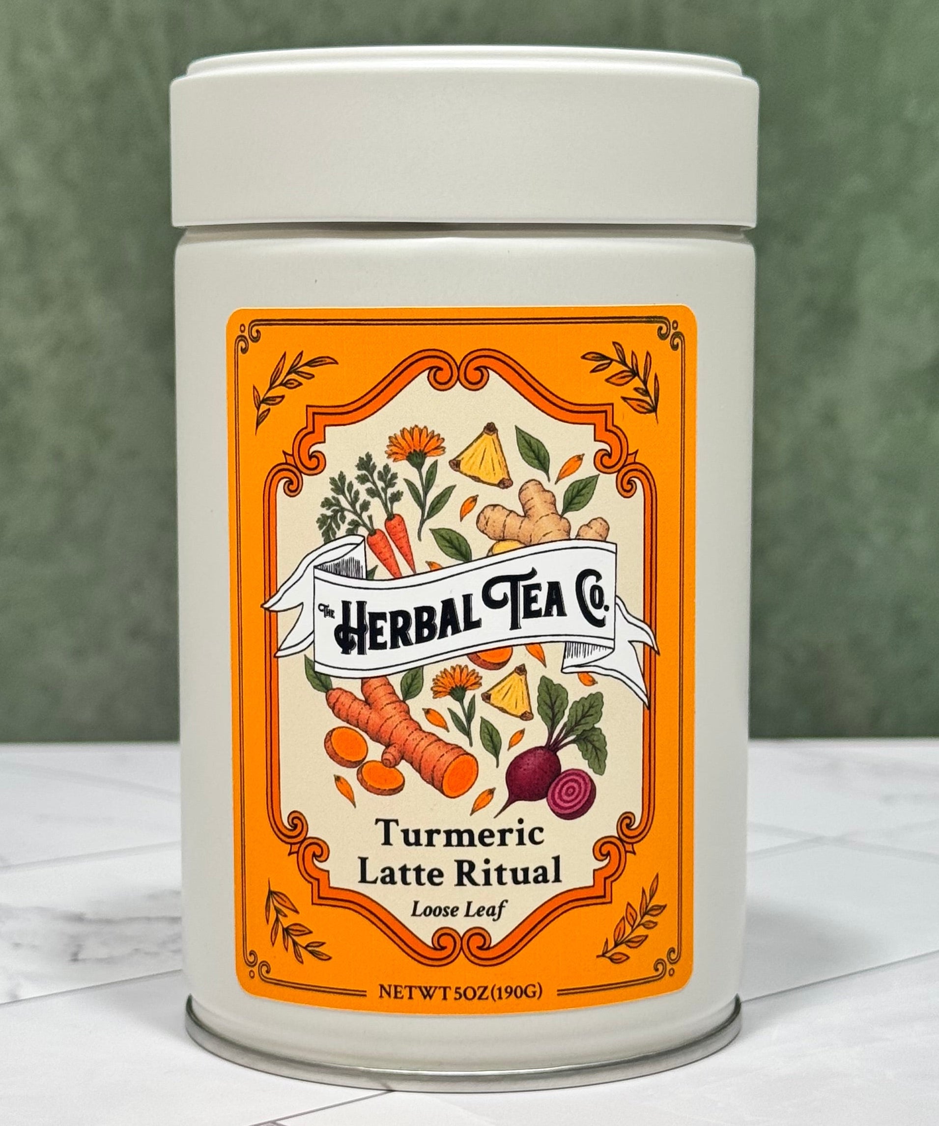 “Front of Turmeric Latte Ritual loose-leaf tea tin with an orange illustrated ingredient label.”