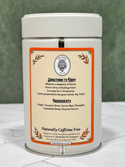 “Back of Turmeric Latte Ritual tea tin showing brewing directions, ingredients, and naturally caffeine-free labeling.”