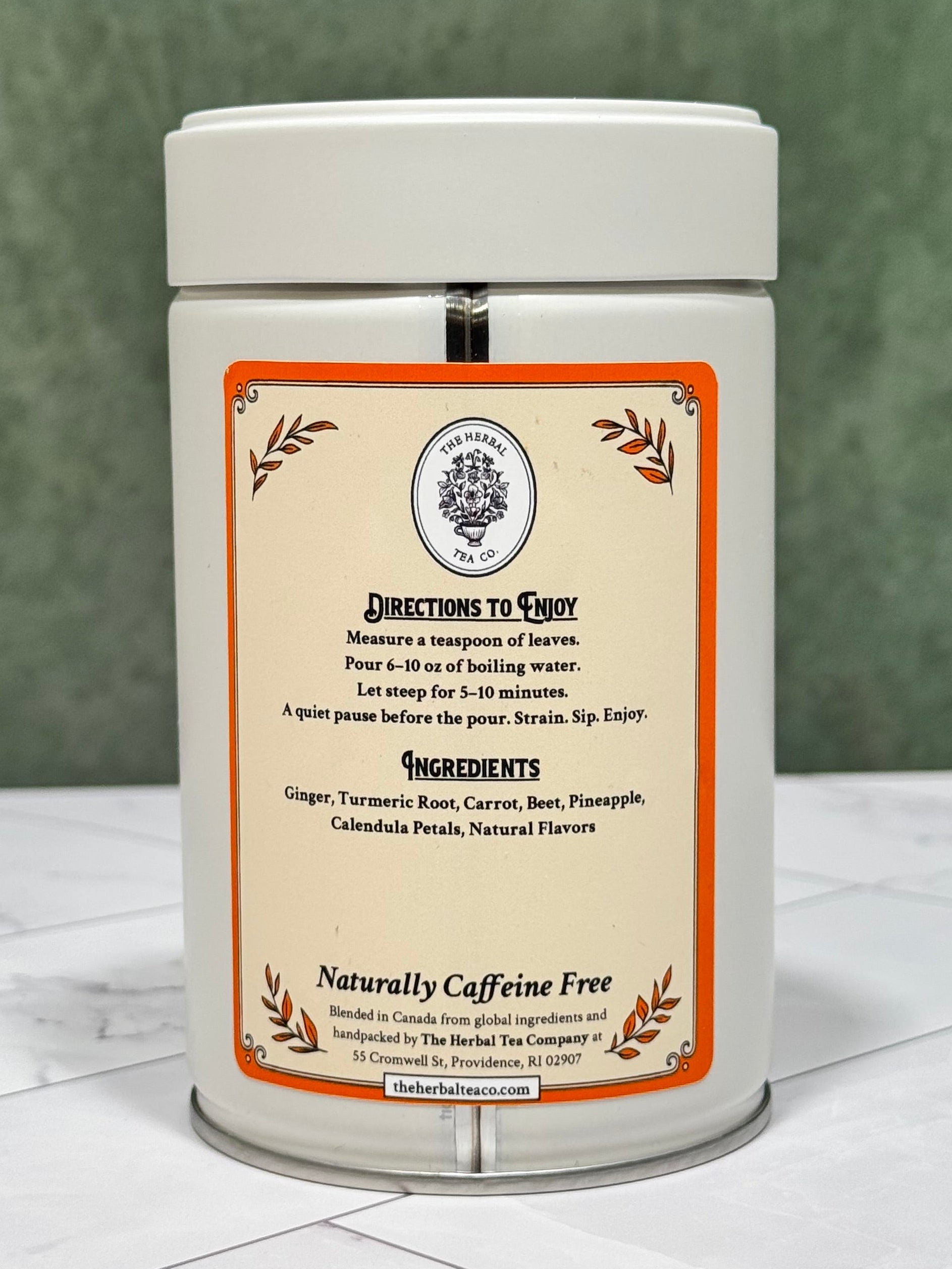“Back of Turmeric Latte Ritual tea tin showing brewing directions, ingredients, and naturally caffeine-free labeling.”